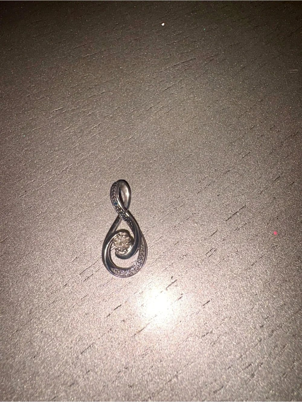Black & white diamond accent cluster infinity pendant in sterling silver.